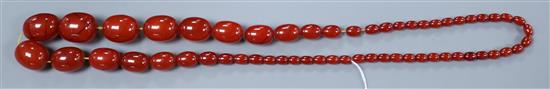 A single strand graduated simulated pale cherry amber bead necklace, gross weight 164 grams, approx. 92cm.